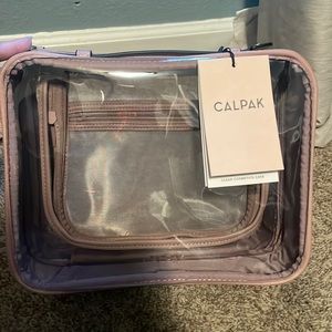 NWT CALPAK Clear Cosmetics Case in Mauve